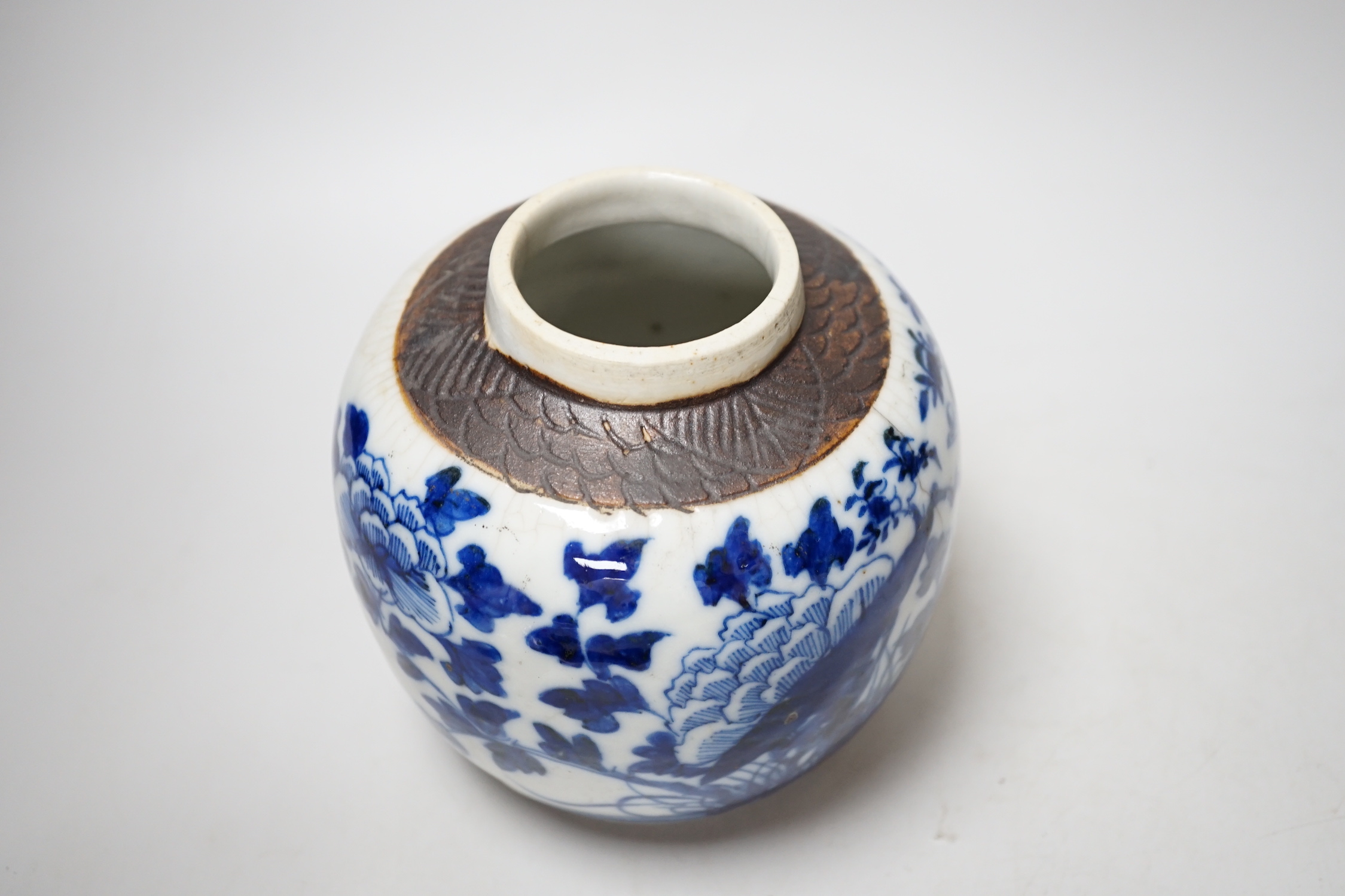 A Chinese famille rose plate, a cantonese plate and a blue and white crackle glaze jar